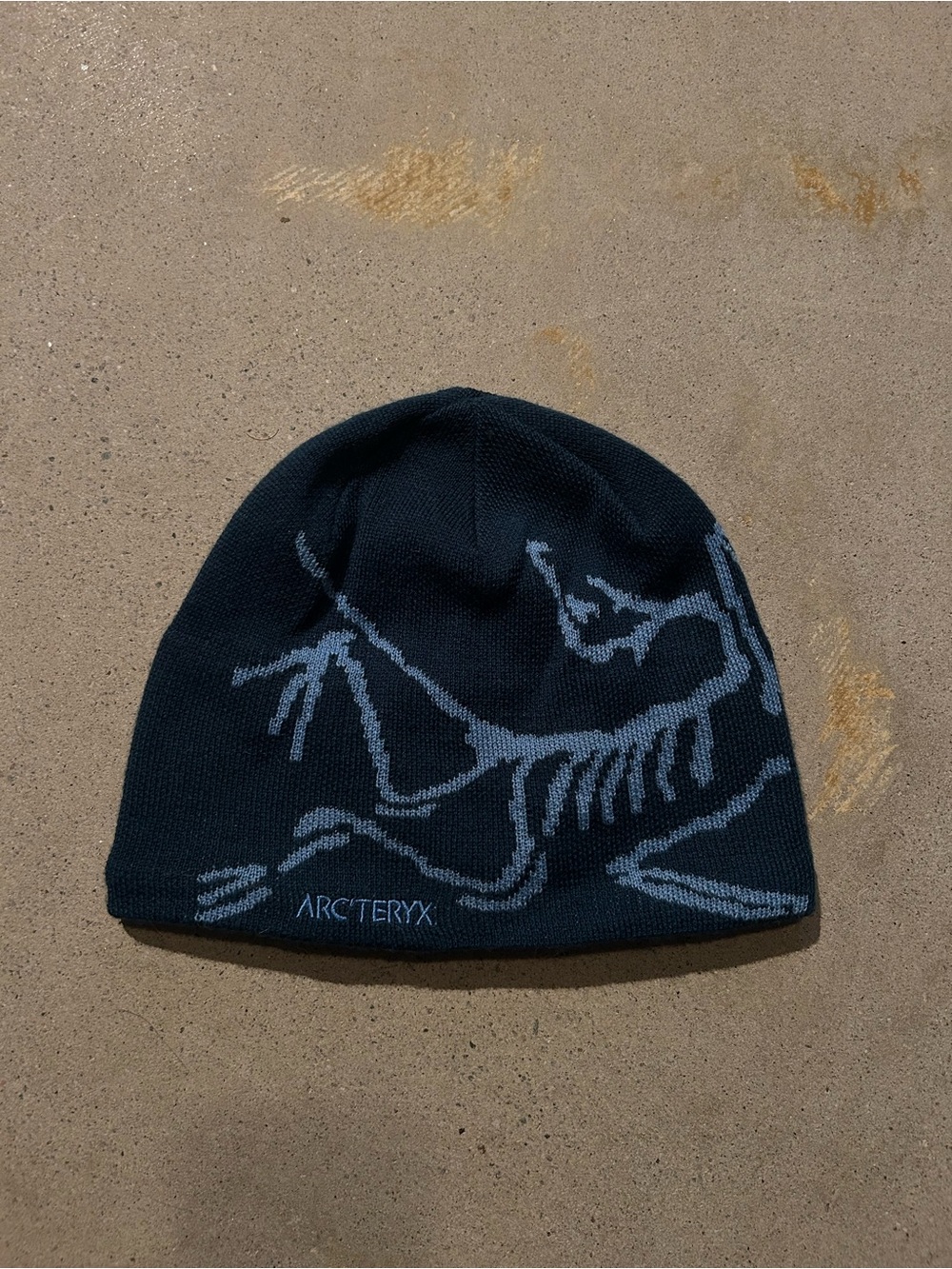 Arc'teryx Navy Beanie with Light Blue Skeleton Bird Motif